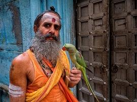 Sadhu with parrot, Varanasi